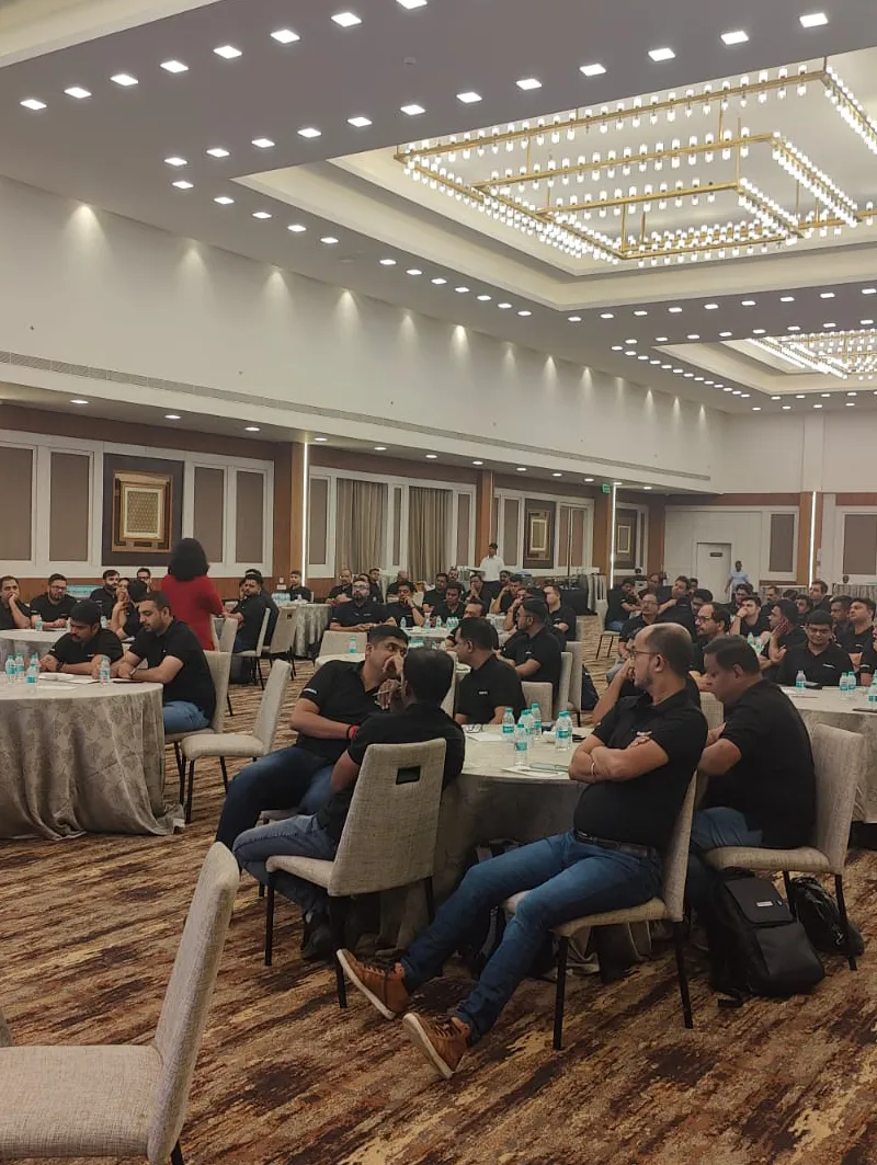 Aishwarya Ram facilitating an corporate activity with a group